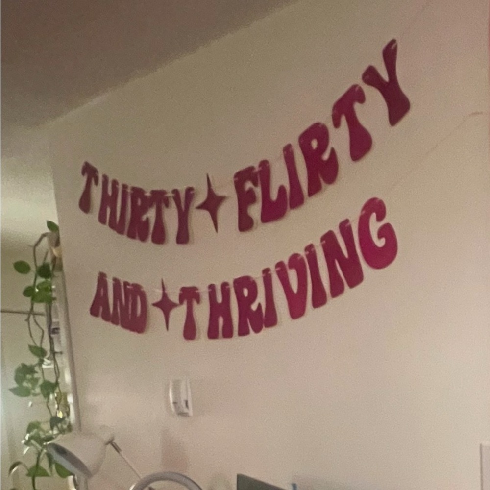 ‘Thirty Flirty and Thriving’ banner